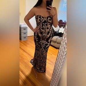 Sequin black and gold long evening gown.  Has a little train.